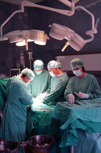 doctors and nurses working on a surgery procedure