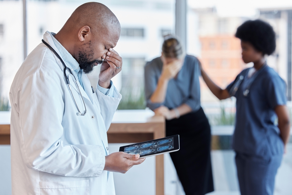 Surgeon, man and medical error or frustrated at hospital with tablet or bad news for patient